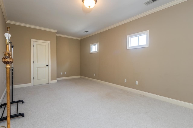 carpeted spare room featuring crown molding and a healthy amount of sunlight