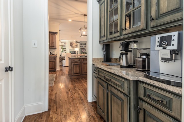 1911 Hazelton Dr, Germantown, TN 38138 - bar with decorative light fixtures, baseboards, and dark wood-type flooring