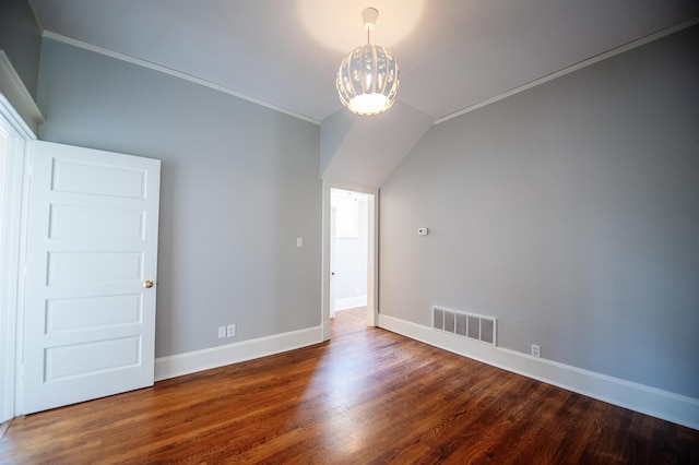 unfurnished room featuring lofted ceiling, hardwood / wood-style floors, and crown molding