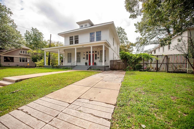 view of front of house with a porch and a front lawn