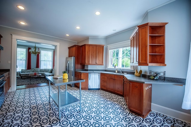 kitchen featuring stainless steel appliances, a notable chandelier, ornamental molding, and sink