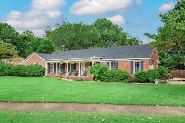 ranch-style home featuring a front yard and a porch