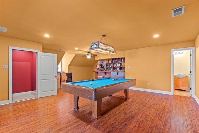 playroom with hardwood / wood-style flooring, vaulted ceiling, billiards, ceiling fan, and wet bar