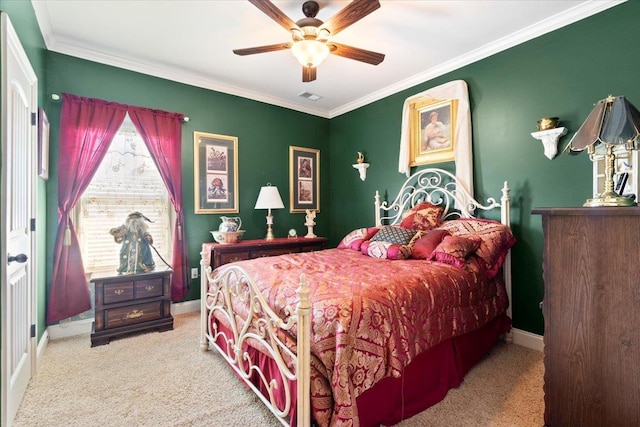 bedroom featuring ornamental molding, ceiling fan, and light colored carpet