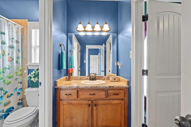 bathroom featuring vanity and toilet