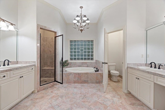 full bathroom with vanity, independent shower and bath, an inviting chandelier, crown molding, and toilet