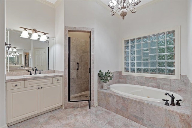 bathroom with independent shower and bath, vanity, ornamental molding, and a notable chandelier