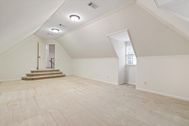 bonus room featuring light carpet and lofted ceiling