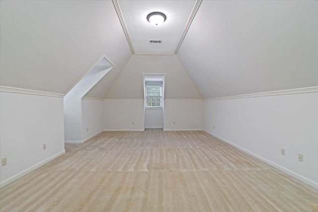 additional living space featuring light carpet and lofted ceiling