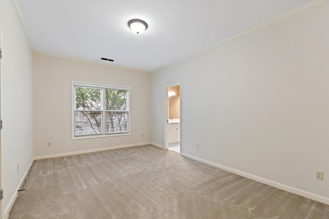 carpeted empty room with crown molding