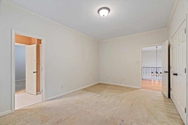 unfurnished bedroom featuring light colored carpet and crown molding