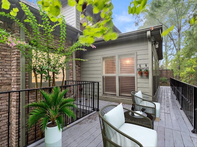 wooden deck with an outdoor living space