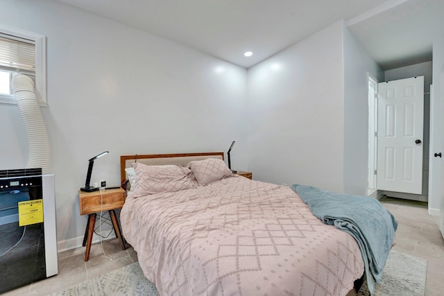 bedroom with light tile patterned floors