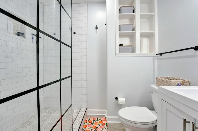 bathroom with vanity, toilet, tile patterned floors, and an enclosed shower