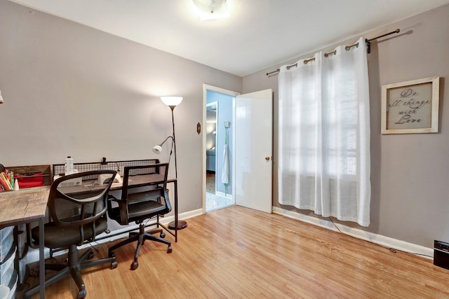 office space with light wood-type flooring