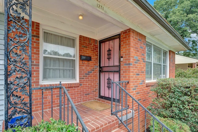 doorway to property with a porch