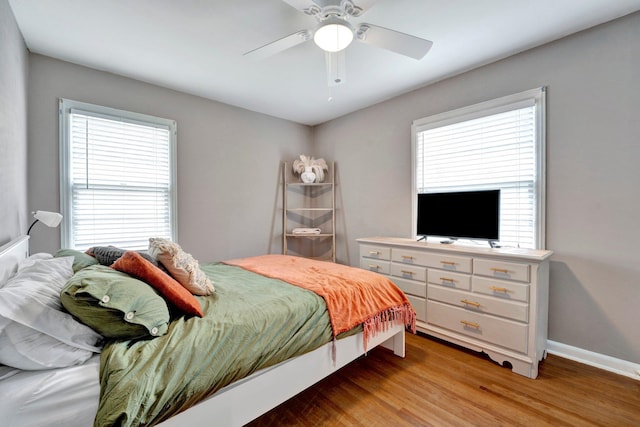 bedroom featuring light wood-type flooring and ceiling fan