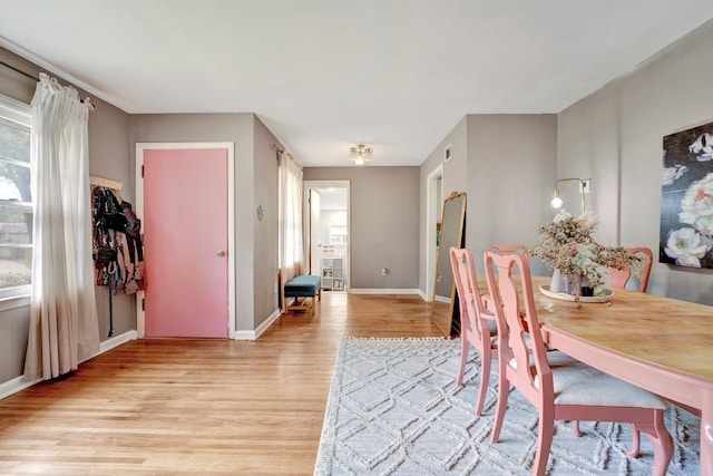 dining space with light wood-type flooring