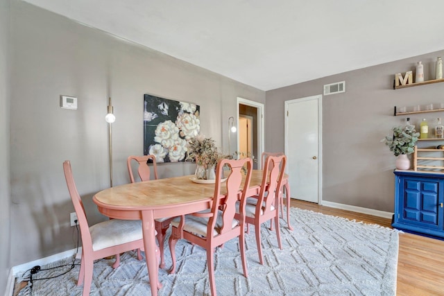 dining room with hardwood / wood-style flooring