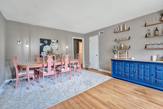 dining room featuring light hardwood / wood-style floors