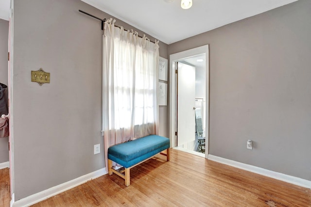 living area with hardwood / wood-style floors and a wealth of natural light