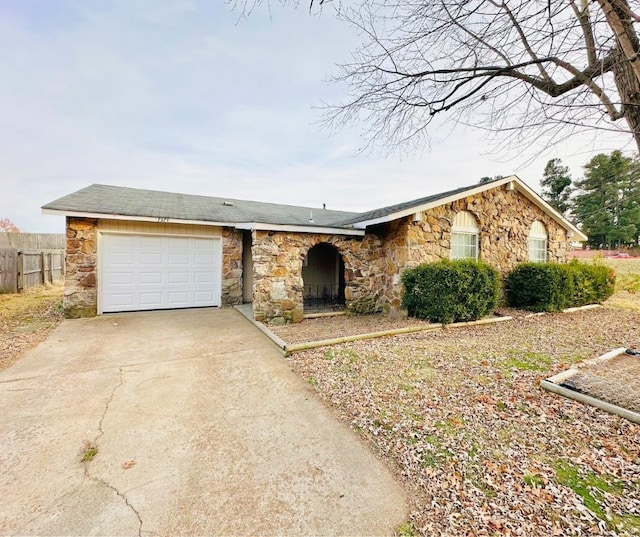 ranch-style house featuring a garage