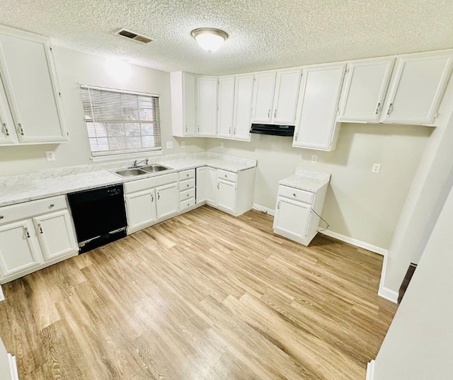 kitchen with black dishwasher, light hardwood / wood-style floors, and white cabinetry