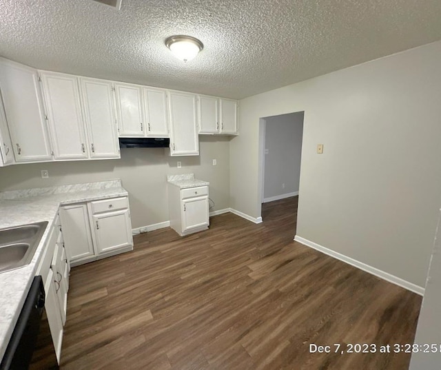 kitchen featuring white cabinets, sink, a textured ceiling, dark wood-type flooring, and black dishwasher