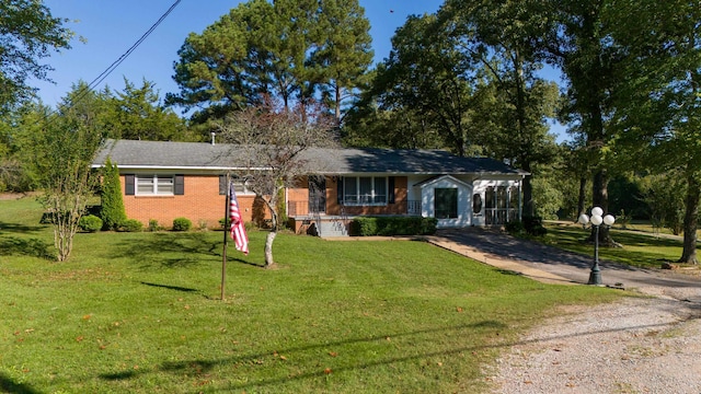 ranch-style home featuring a front yard