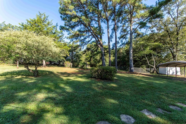 view of yard with a carport