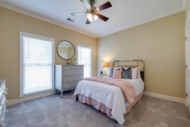 bedroom featuring multiple windows, ceiling fan, and light carpet