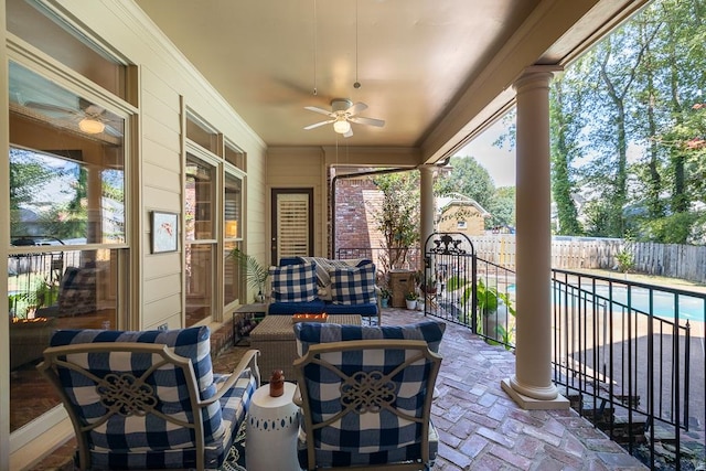 view of patio / terrace featuring a fenced in pool and ceiling fan