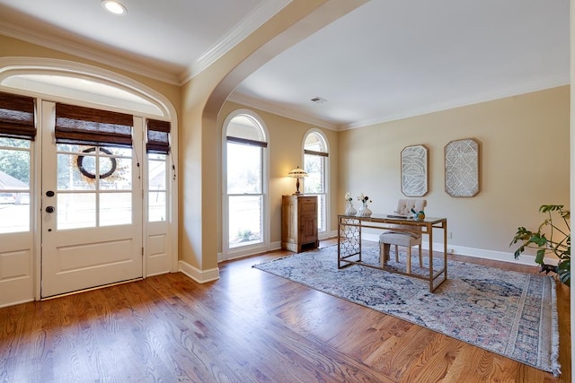 entrance foyer with light wood-type flooring and crown molding