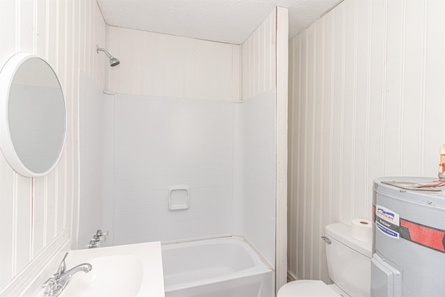 full bathroom with water heater, vanity, a textured ceiling, tiled shower / bath combo, and toilet