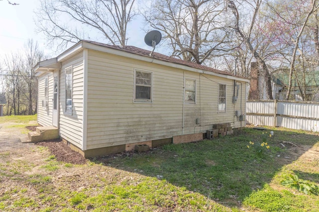 back of property featuring a yard