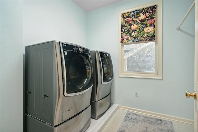 clothes washing area featuring washing machine and dryer