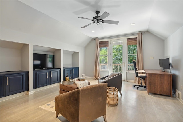 living room with light wood-type flooring, vaulted ceiling, and ceiling fan