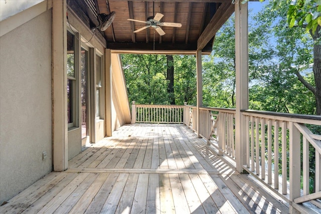 wooden terrace featuring ceiling fan