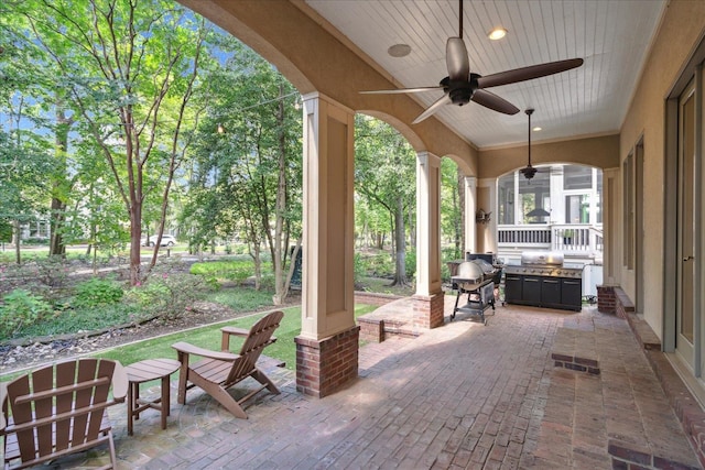 view of patio with grilling area and ceiling fan