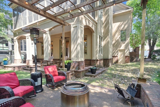 view of patio / terrace featuring a pergola and an outdoor fire pit