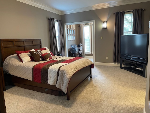 bedroom with ornamental molding, multiple windows, and light carpet