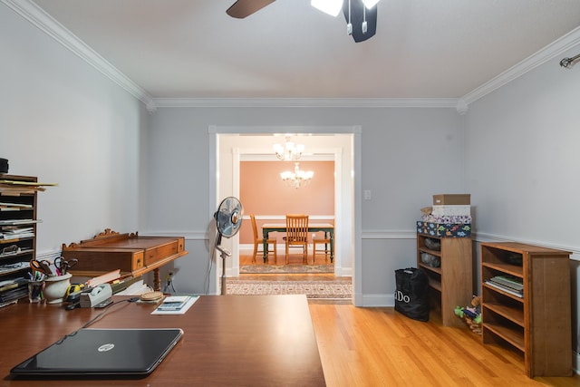 office featuring ceiling fan with notable chandelier, crown molding, and hardwood / wood-style floors