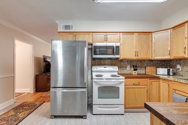 kitchen featuring wood counters, light hardwood / wood-style flooring, stainless steel appliances, decorative backsplash, and crown molding