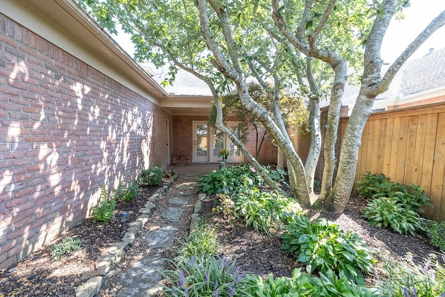 view of yard with french doors