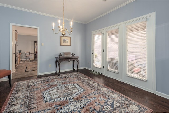 interior space with crown molding, dark hardwood / wood-style flooring, and a chandelier