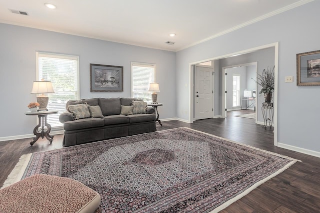 living room with ornamental molding and dark hardwood / wood-style floors