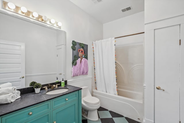 full bathroom featuring vanity, shower / bath combo with shower curtain, and toilet