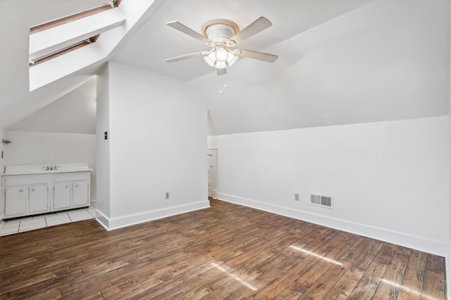 bonus room featuring lofted ceiling, ceiling fan, hardwood / wood-style floors, and sink