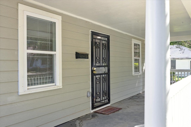 entrance to property with a porch