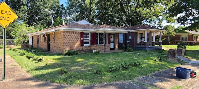 ranch-style house featuring a front yard and a porch